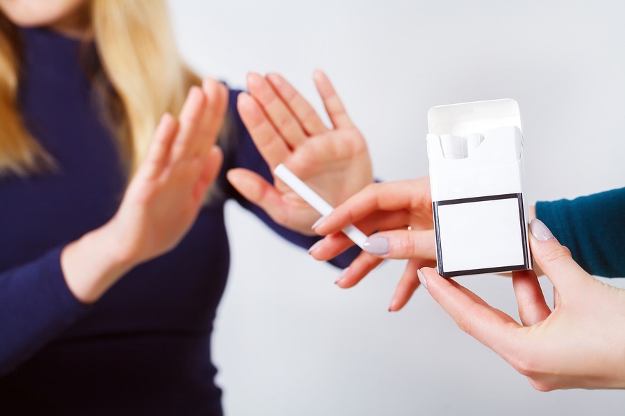 Closeup Of Woman Giving Up Smoking Cigarettes. Health Concept
